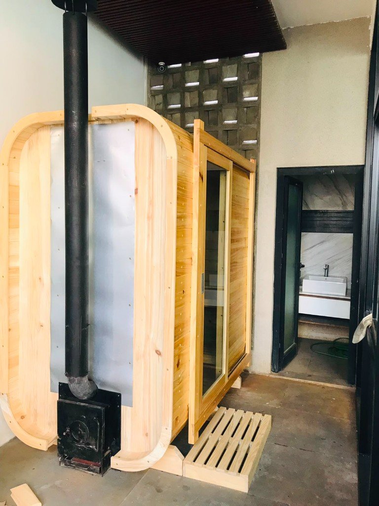 Cube sauna with side sliding-door entry and wood-fired heater in BSD, Tangerang Selatan